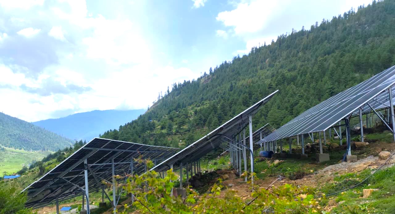 Ground-mounted solar array on the hillside above Kankasundari village