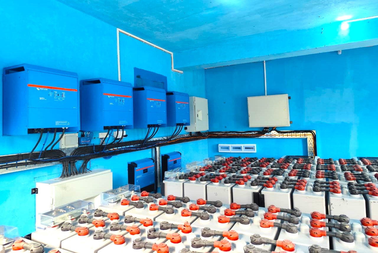 Battery room showing the Victron Quattro inverters and tubular gel battery bank