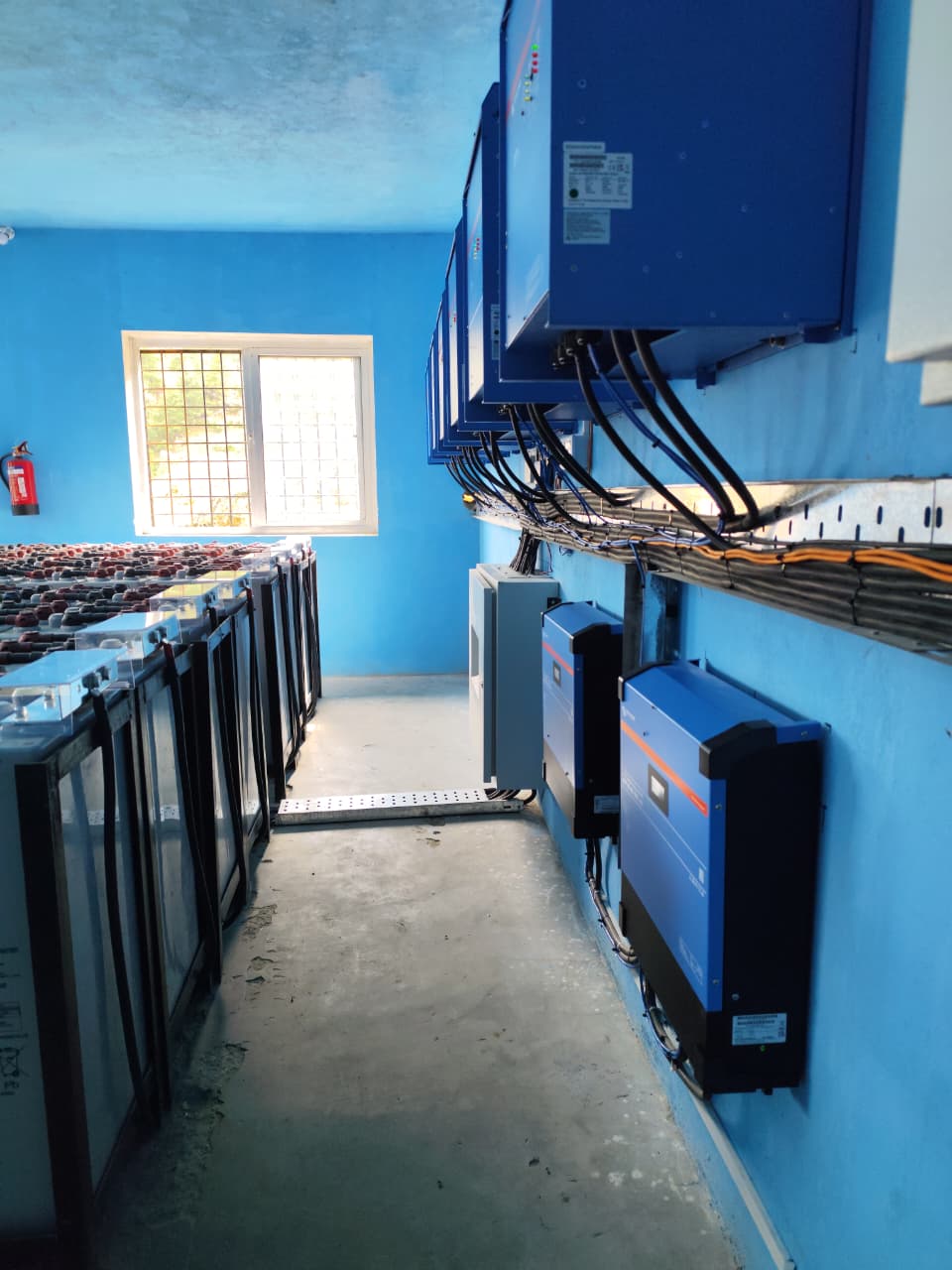 Interior of the Kankasundari power house, battery bank and inverter wall